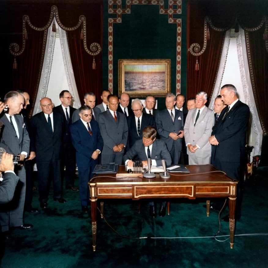 President Kennedy signs the Nuclear Test Ban Treaty in the White House Treaty Room - October 7, 1963, digital photograph intervention